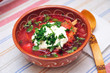 Beetroot soup with meat in ceramic bowl