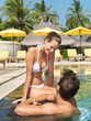Romantic love couple swimming in a pool