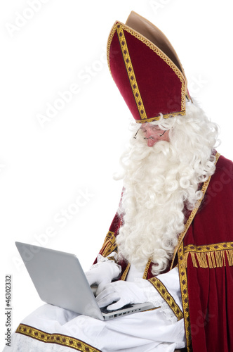 Photo: Sinterklaas using a laptop Sinterklaas using a laptop