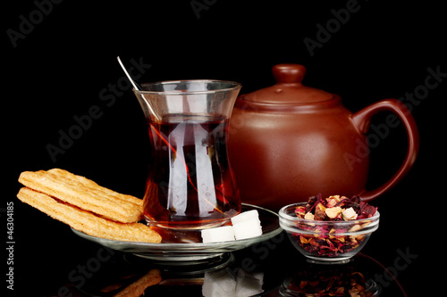 Photo: glass of Turkish tea isolated on black glass of Turkish tea isolated on black