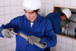 portrait of a young plumber