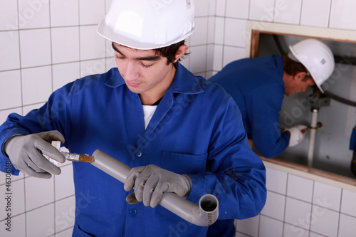 Photo: portrait of a young plumber portrait of a young plumber