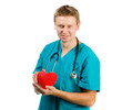 Photo: Male doctor with a heart in his hands Male doctor with a heart in his hands