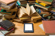 Ebook and old books on table