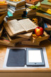 Ebook and old books on table