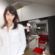 Young woman in open kitchen