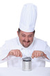 Chef cutting into tin can
