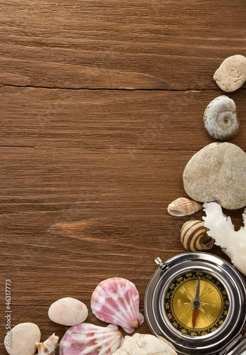 Photo: seashell and compass on wood seashell and compass on wood