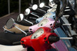 A line of mopeds/scooters