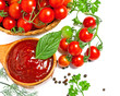 Red tomato sauce in a spoon and ingredients, isolated in white