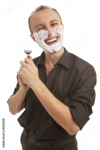 Photo: smiling man shaving smiling man shaving