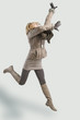 Photo: woman in winter clothes jumping woman in winter clothes jumping