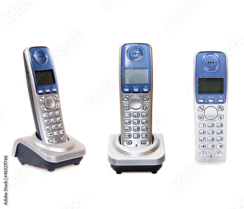 Photo: Wireless telephone with cradle isolated on white background Wireless telephone with cradle isolated on white background