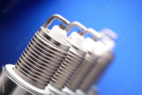 Photo: spark plug on blue background spark plug on blue background