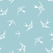 blue seamless pattern with white little swallows