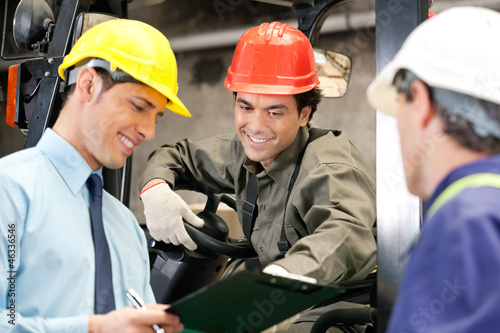 Photo: Workers And Supervisors At Warehouse Workers And Supervisors At Warehouse