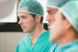 Three surgeons in operating theatre