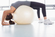 Photo: Woman stretching using exercise ball Woman stretching using exercise ball
