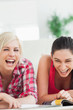 Photo: Women lying on the floor laughing Women lying on the floor laughing