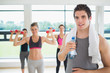 Photo: Man taking break from aerobics class Man taking break from aerobics class