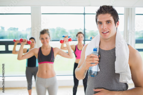 Photo: Man taking break from aerobics class Man taking break from aerobics class