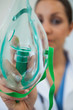 Doctor holding up oxegen mask
