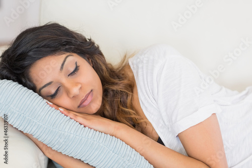 Photo: Woman resting her head on a pillow Woman resting her head on a pillow