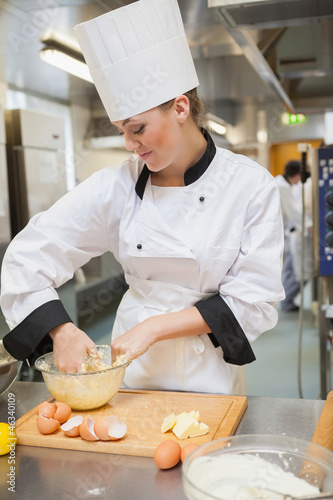 Photo: Woman kneading dough Woman kneading dough