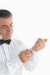 Foto: Man adjusting his shirt Man adjusting his shirt