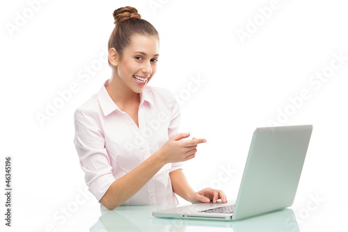 Photo: Woman pointing at laptop Woman pointing at laptop