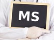 Doctor shows information on blackboard: MS