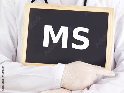 Photo: Doctor shows information on blackboard: MS Doctor shows information on blackboard: MS