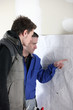 craftsman and young apprentice working together