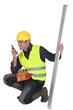 Construction worker with a walkie talkie