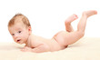 Photo: Healthy baby on the bed. Healthy baby on the bed.