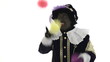Zwarte Piet is juggling with colored balls