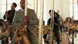 Video: Group of serious businessmen in suits riding carousel horses Group of serious businessmen in suits riding carousel horses