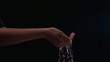 Water dripping from Hispanic teenage girl's hands