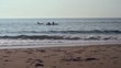People in kayaks in ocean