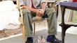 Portrait of mixed race artist in his studio