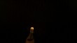 Cork popping out of champagne bottle towards camera (slow motion)