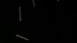 Nails falling against black background (slow motion)