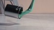 Can of paint falling onto the floor (slow motion)