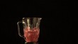 Raspberries and water fly out of blender (slow motion)