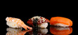 delicious sushi isolated on black