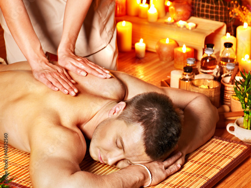 Photo: Man getting aroma massage in spa. Man getting aroma massage in spa.