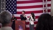Video: Political candidate acknowledges awardee as crowd applauds and waves flags Political candidate acknowledges awardee as crowd applauds and waves flags