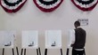 Video: Hispanic voter completing ballot at voting booth and presenting it to camera Hispanic voter completing ballot at voting booth and presenting it to camera