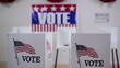 Pan across rows of voting booths at polling place