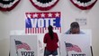 Video: Rows of voters coming and going at voting booths at polling place Rows of voters coming and going at voting booths at polling place